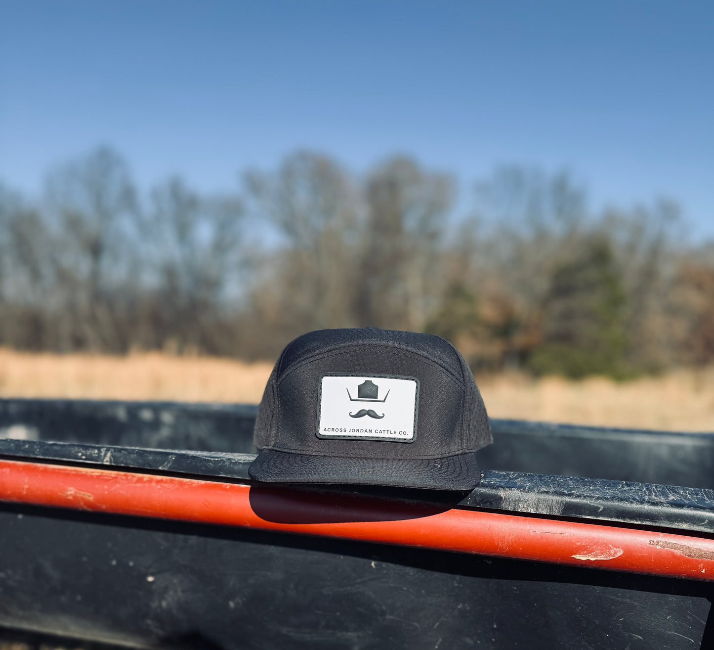 Black Performance hat with white and black rubber patch