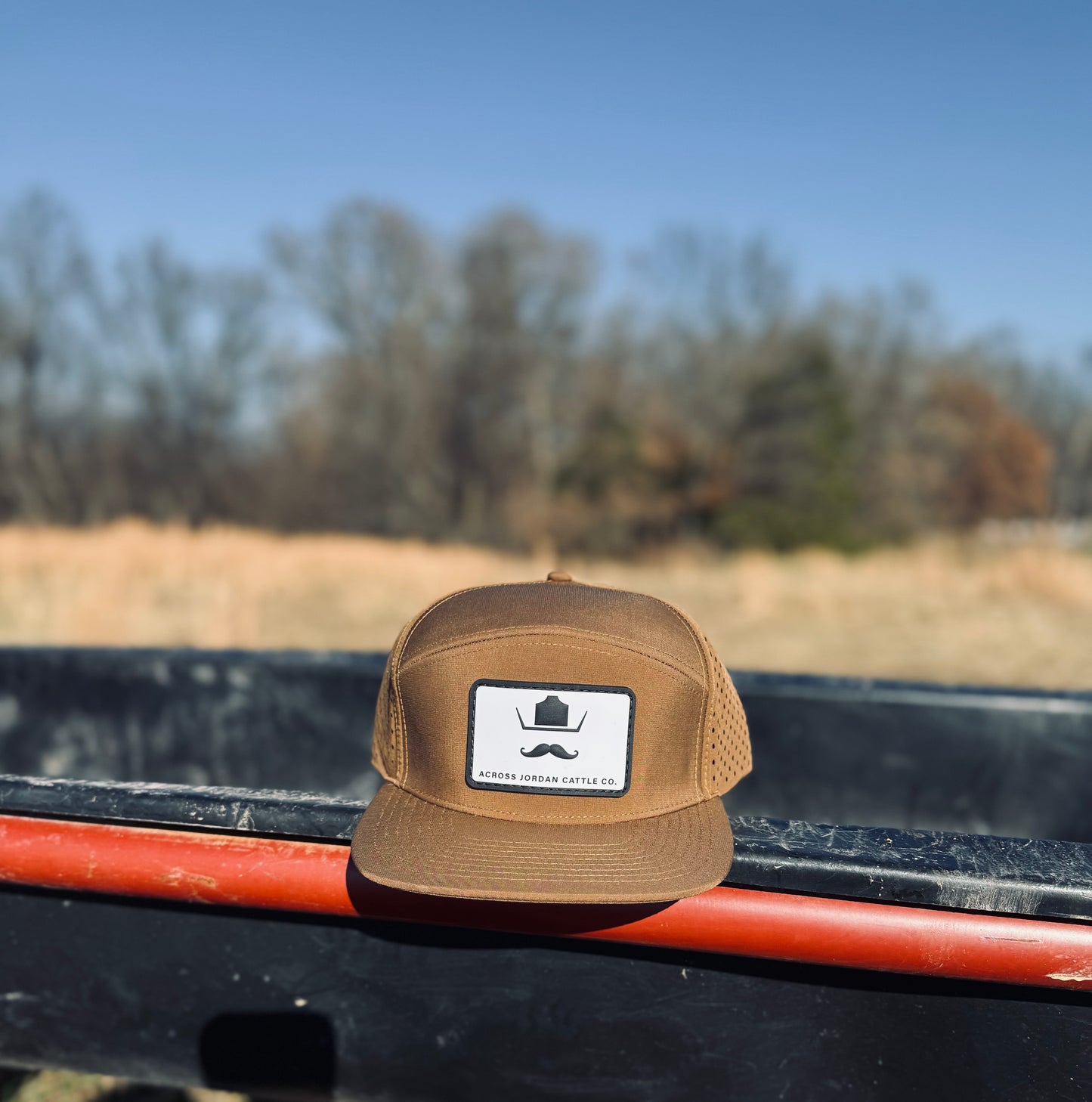 Tan with white and black rubber patch Performance hat